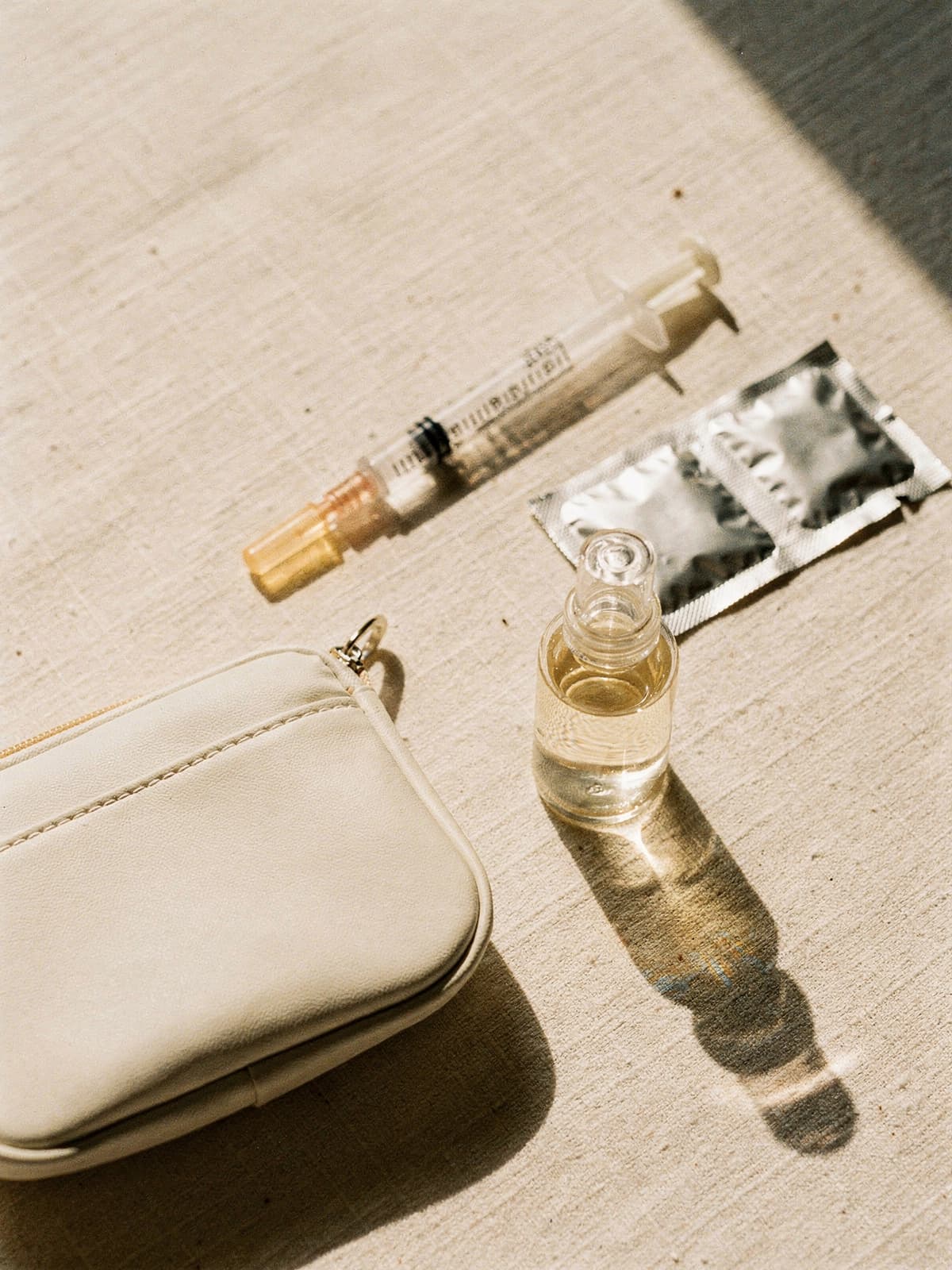 NAD+ vial and syringe on a clean clinical surface
