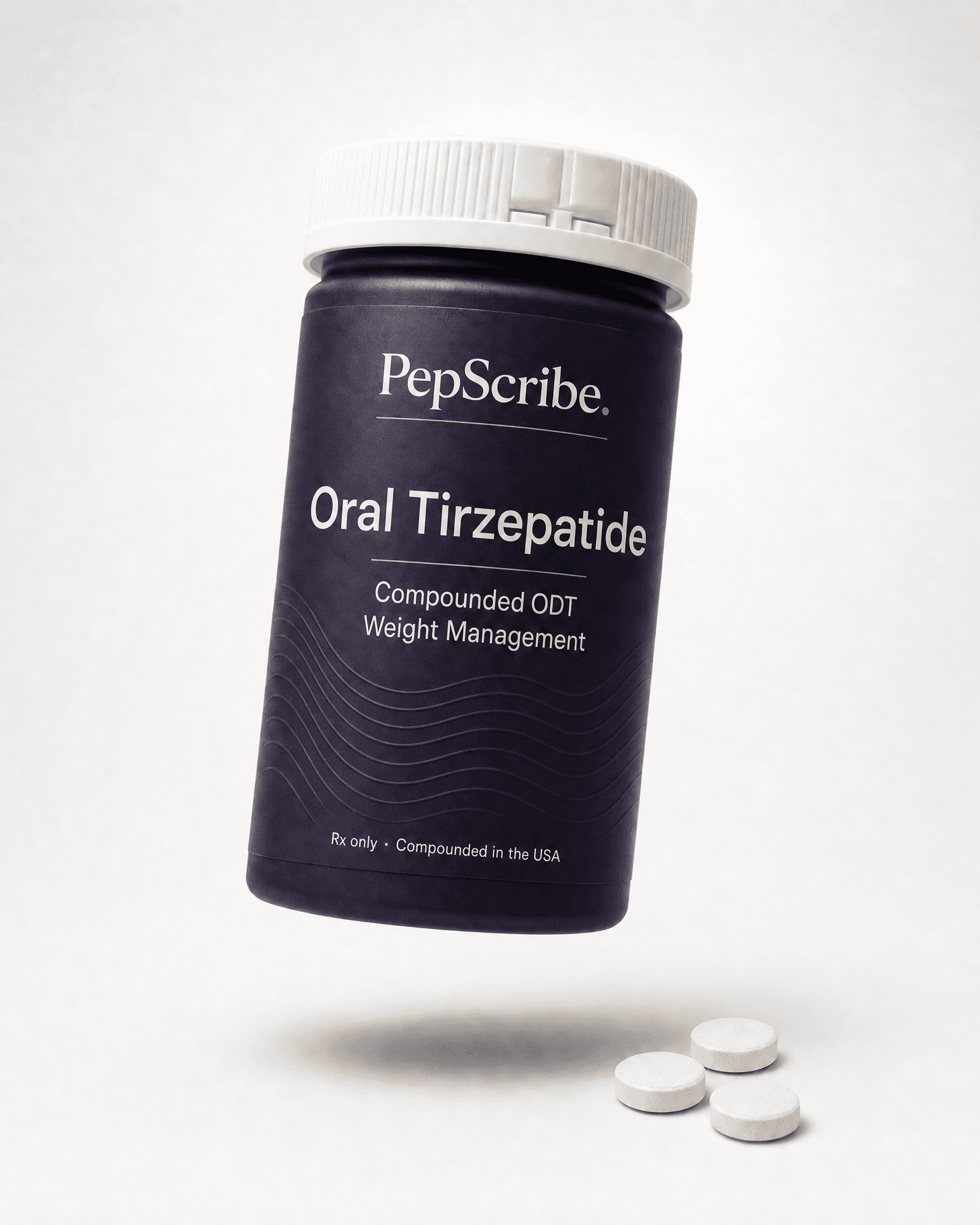 Amber PepScribe pharmacy bottle of compounded oral tirzepatide tablets, angled on a bone surface