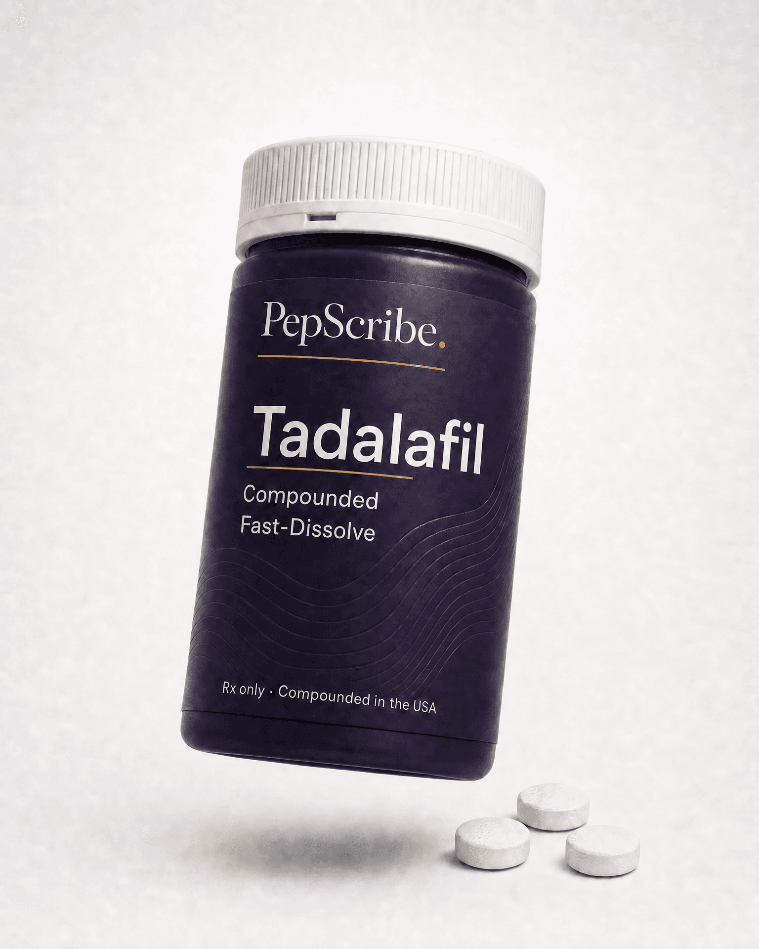 A PepScribe-branded compounded fast-dissolve tadalafil tablet, angled against a soft studio backdrop.